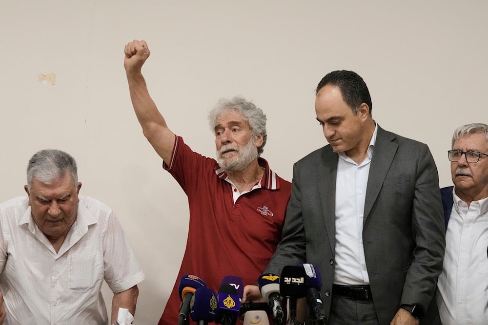 Lebanese pro-Palestinian militant Georges Abdallah raises his fist upon his arrival in Qobayat village, in northern Akkar province, Lebanon, Friday, July 25, 2025 (AP)