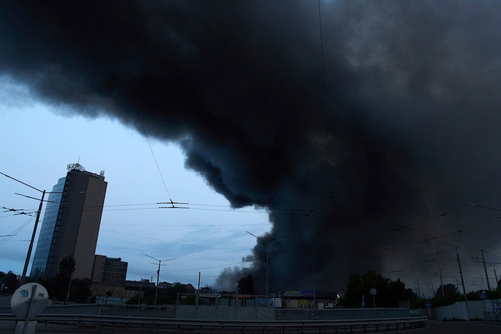 Smoke covers the sky above the city following Russia's missile and drone attack in Kyiv, Ukraine, on June 10, 2025. (AP Photo/Efrem Lukatsky)