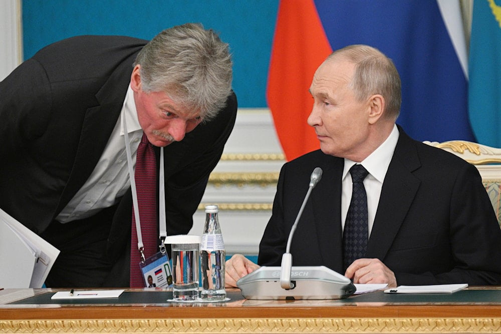 Kremlin spokesman Dmitry Peskov, left, listens to Russian President Vladimir Putin before a signing ceremony at the Akorda presidential residence in Astana, Kazakhstan, Wednesday, Nov. 27, 2024 (AP)
