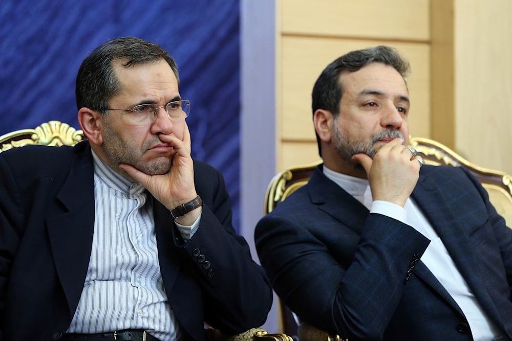 Iran's Foreign Minister Abbas Araghchi, right, and Iranian Deputy FM Majid Takht-e-Ravachi, upon their arrival at the Mehrabad airport in Tehran, Iran, Wednesday, July 15, 2015 (AP)