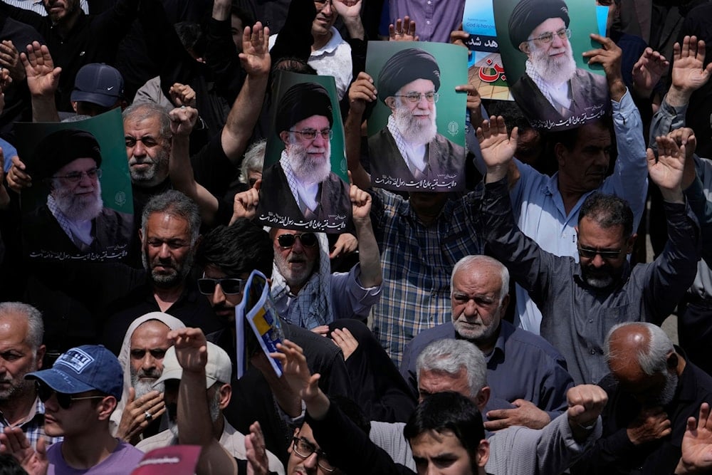 Iranian worshippers chant slogans as they hold up posters of the Iranian Leader Ayatollah Ali Khamenei in an anti-US and anti-Israeli protest after their Friday prayers in Tehran, Iran, Friday, July 25, 2025 (AP)