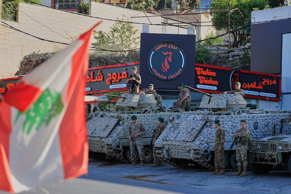 Lebanese army soldiers sit on their armored vehicles near a polling station during municipal elections in the town of Nabatieh, south Lebanon, Saturday, May 24, 2025 (AP)