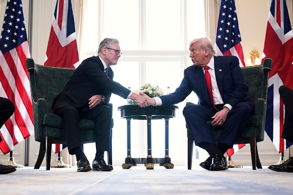 President Donald Trump, right, shakes hands with Britain's Prime Minister Keir Starmer during a meeting at the Trump Turnberry golf course in Turnberry, Scotland Monday, July 28, 2025 (AP)