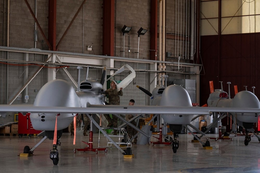 U.S. Army personnel perform maintenance on long-range drones at Fort Huachuca in Sierra Vista, Ariz., Tuesday, July 22, 2025 (AP)