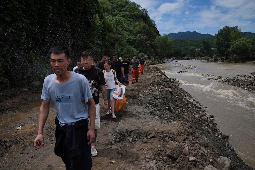 Beijing floods leave 30 dead, 80,000 evacuated
