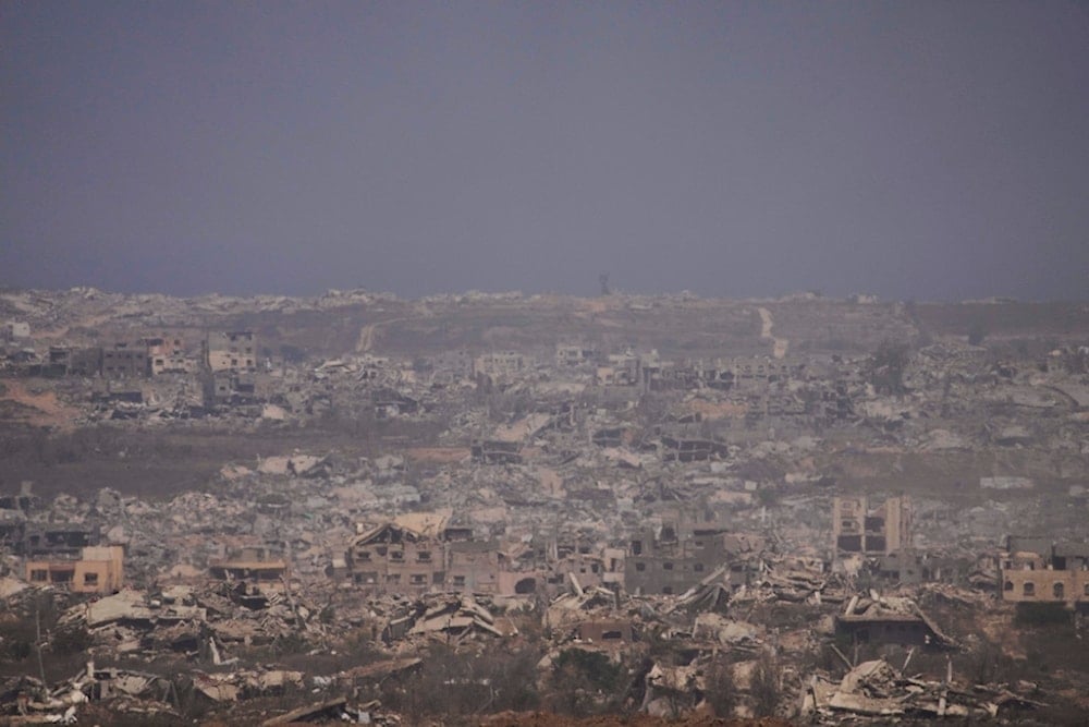 Damaged buildings in the Gaza Strip, seen from southern occupied Palestine, Tuesday, July 29, 2025 (AP)