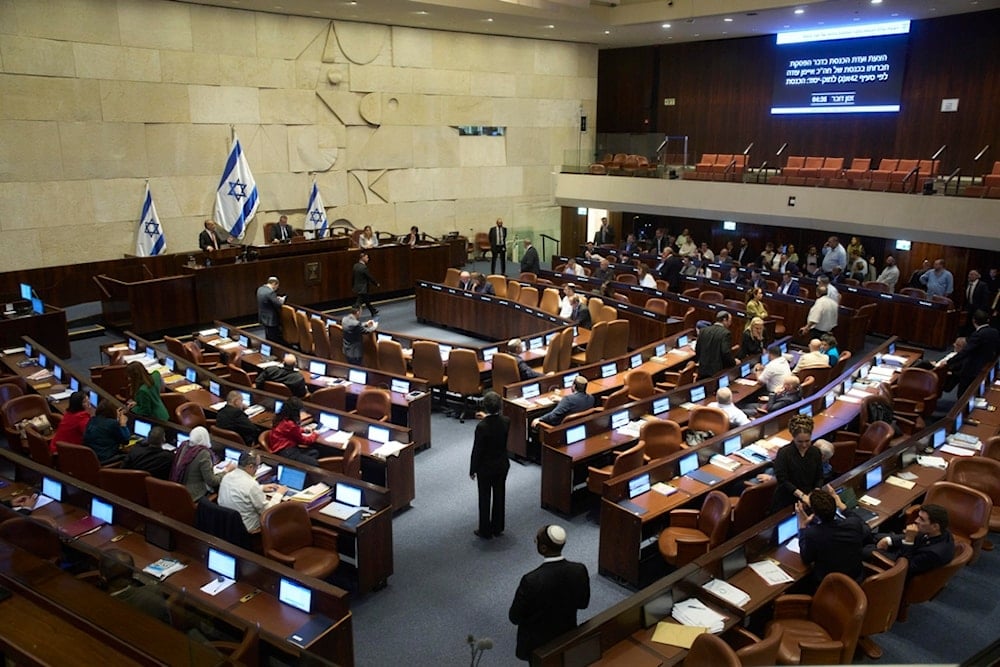 Lawmakers attend a session of the Knesset, Israel's parliament, in occupied al-Quds, Monday, July 14, 2025 (AP)