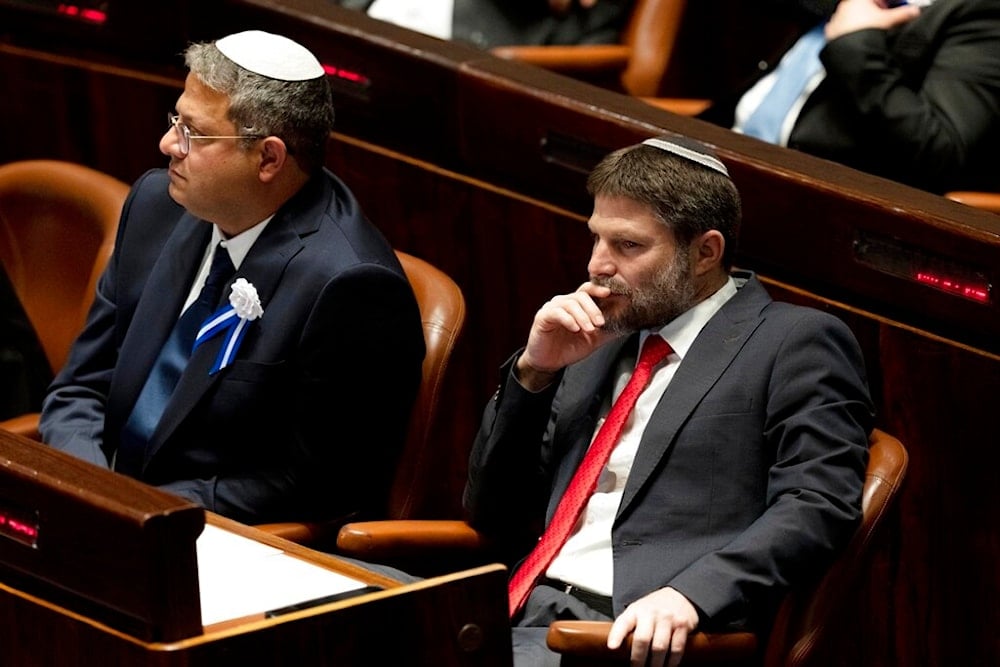Far-right Israeli lawmakers Itamar Ben Gvir, and Bezalel Smotrich, attend the swearing-in ceremony for the Israeli parliament, at the Knesset, in Jerusalem, Tuesday, Nov. 15, 2022 (AP)