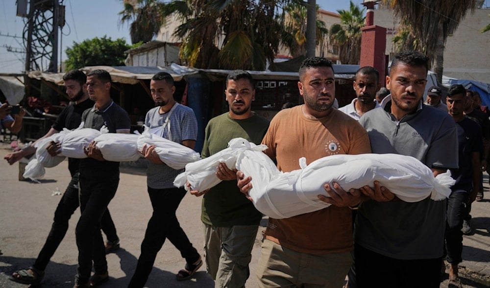Relatives carry the bodies of two Palestinian sisters Mira, 8, and Sabah Bashir, 10, who were killed in an Israeli airstrike on the Gaza Strip, during their funeral in Deir al-Balah, Wednesday, July 2, 2025. (AP)