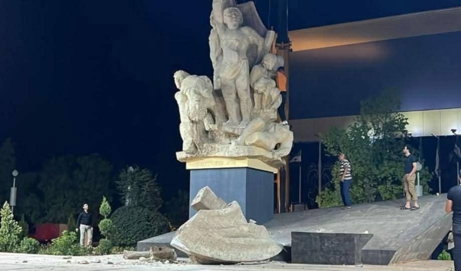 A piece of the Martyrs' Monument can be seen on the floor as it is being destroyed, Aleppo, Syria, July 2, 2025 (social media)