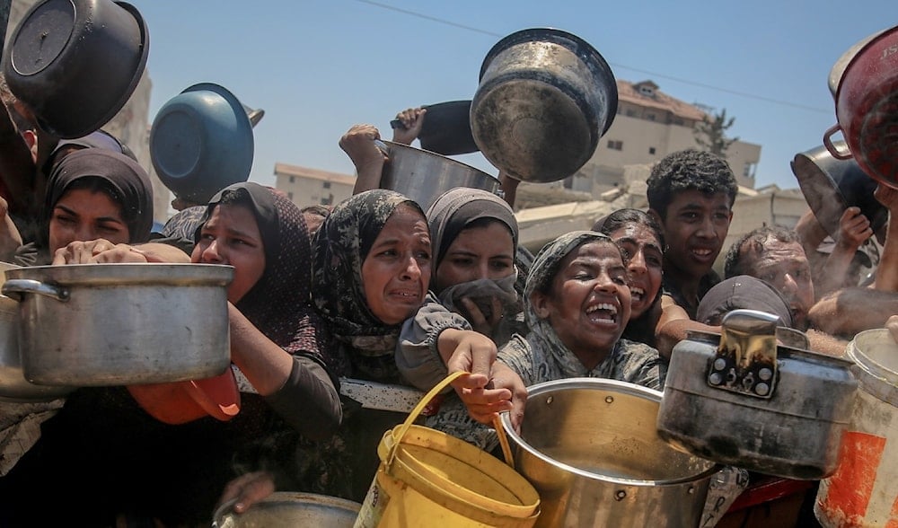 Droves of Palestinians battle to gather food assistance at an aid distribution point in Gaza, Occupied Palestine, undate (Social Media)