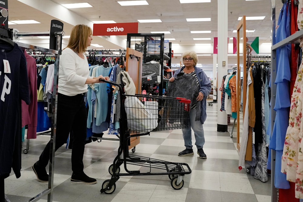 Customers shop at a retail store in Vernon Hills, Ill., Monday, June 12, 2023.