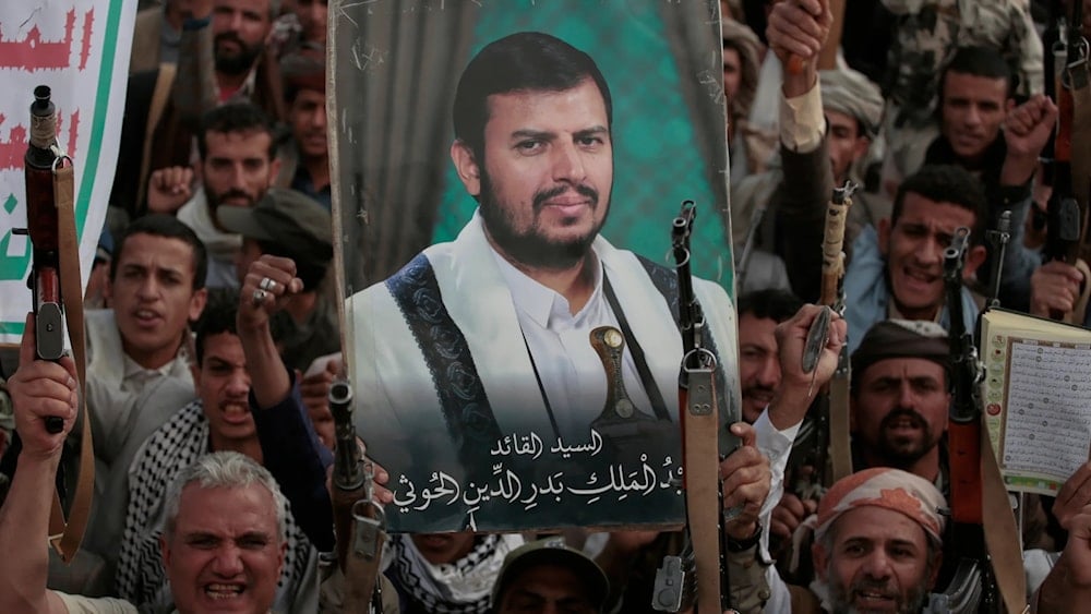 Houthi supporters chant slogans and hold pictures of Abdul Malik al-Houthi, the leader of the Houthi movement, during an anti-US and anti-'Israel' rally in Sanaa, Yemen, Monday, March 17, 2025 (AP)