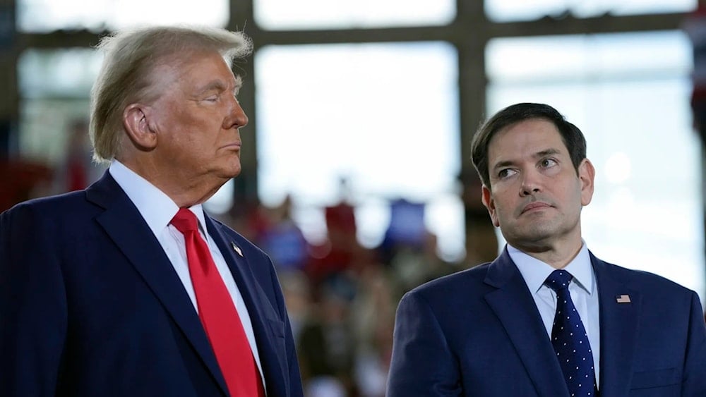 Trump speaks with then-Senator Marco Rubio during a campaign rally on Nov. 4, 2024, in Raleigh, NC (AP)