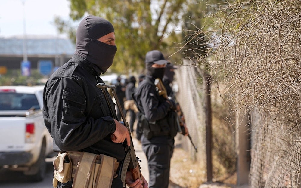 Security forces of Syria's interim government stand guard on the road leading to the airport, in the Damascus' suburb of Jaramana on April 29, 2025 (AP)