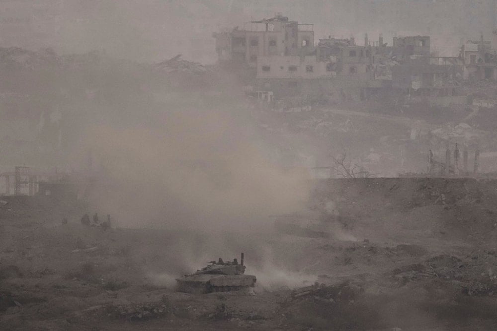 An Israeli army tank advances in the Gaza Strip, as seen from the southern occupied territories on Thursday, July 3, 2025. (AP Photo/Leo Correa)