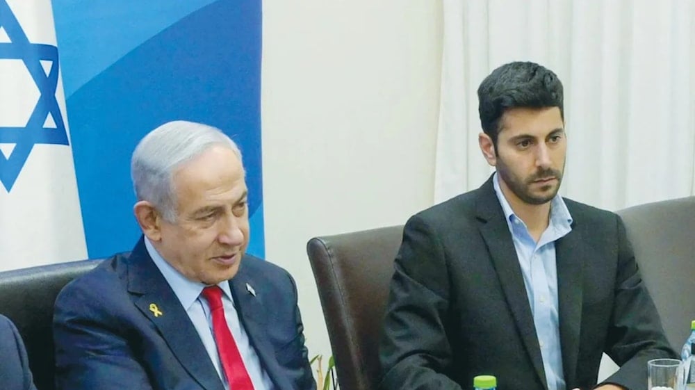 Israeli Prime Minister Benjamin Netanyahu.s spokesman Omer Dostri sitting next to Netanyahu himself. (Agencies)