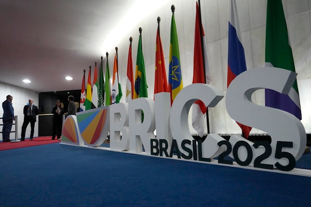 A sign announcing the 11th BRICS Parliamentary Forum stands at the entrance to the Federal Senate in Brasilia, Brazil, Wednesday, June 4, 2025. (AP Photo/Eraldo Peres)