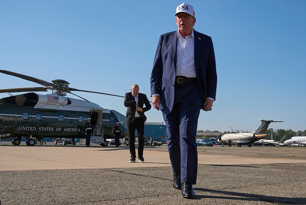 President Donald Trump walks toward the media to speak with them before boarding Air Force One, at Morristown Municipal Airport in Morristown, NJ, Sunday, July 6, 2025 (AP)