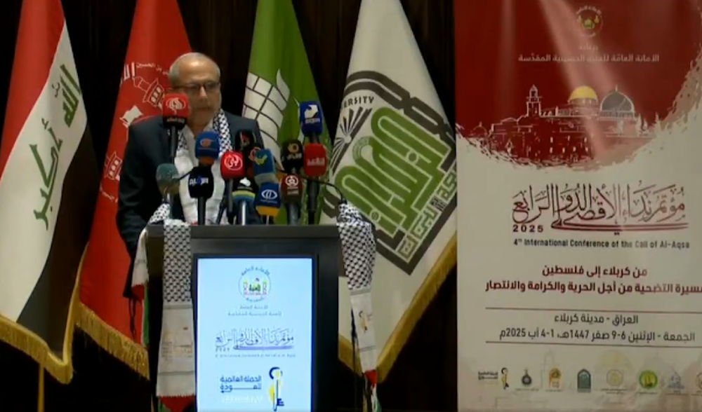 Dr. Abdel Latif al-Hajj, Deputy Minister of Hospital Affairs in Gaza and director of a local hospital, delivers a speech during the fourth Al-Aqsa Call conference in Karbala, August 1, 2025 (Screengrab)