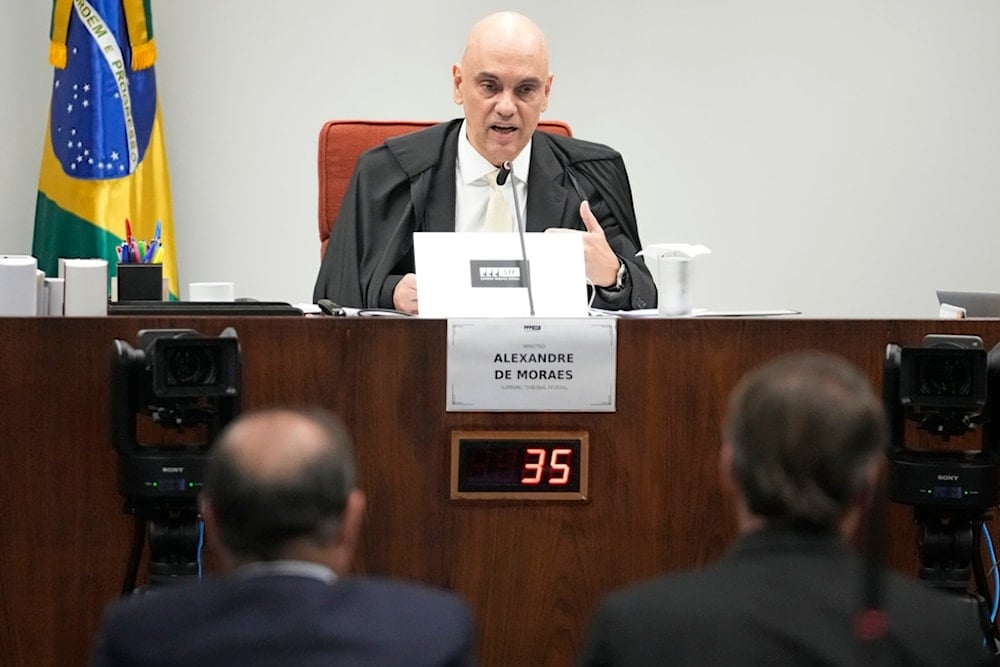 Supreme Court Judge Alexandre de Moraes hears testimony from Brazil's former President Jair Bolsanaro during a trial for those accused in an alleged coup plot to keep Bolsonaro in office in Brasilia, Brazil, Tuesday, June 10, 2025 (AP)