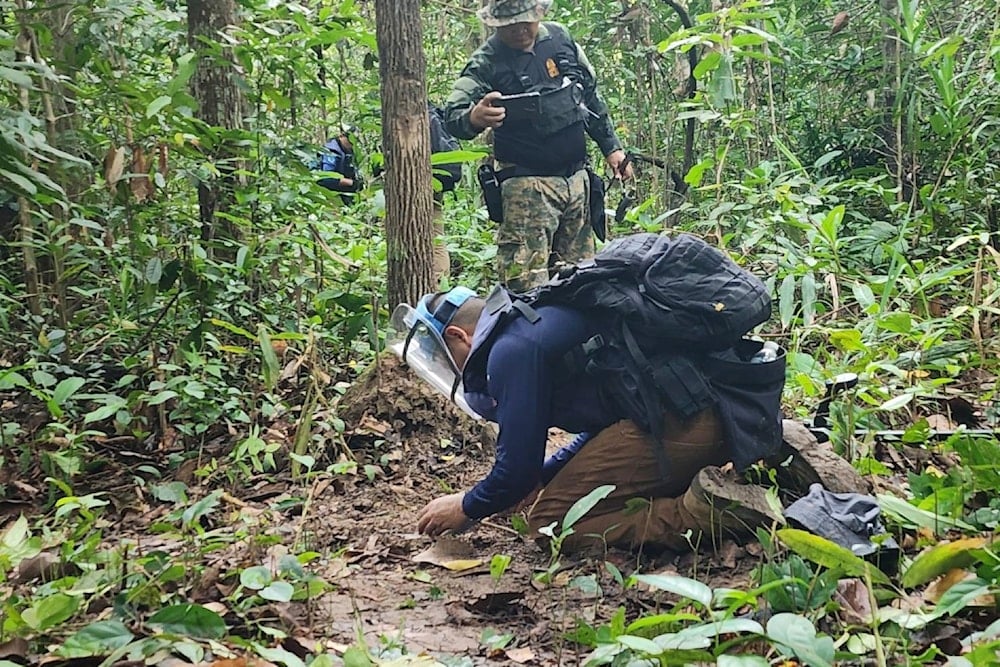 Thai soldiers inspect a border area on Sunday, July 20, 2025, in Ubon Ratchathani province, where the Royal Thai Army said two anti-personnel landmines were found (AP)