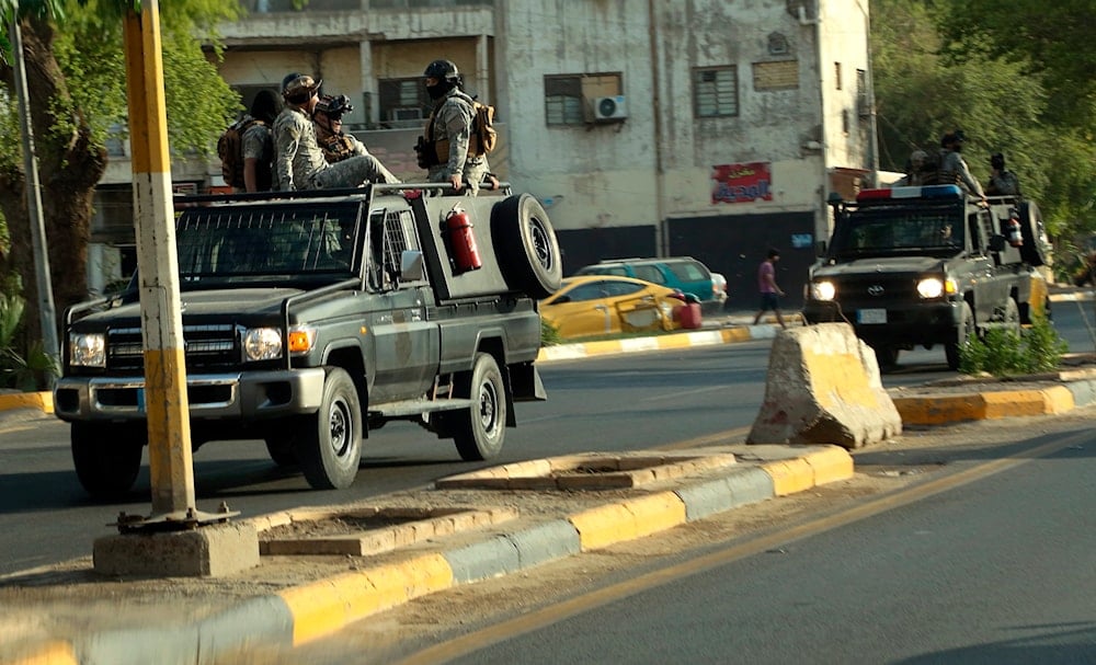 In this May 26, 2021 file photo, Popular Mobilization Forces, PMF, patrol outside the heavily fortified Green Zone, where the Prime Minister's headquarters is in Baghdad, Iraq (AP)