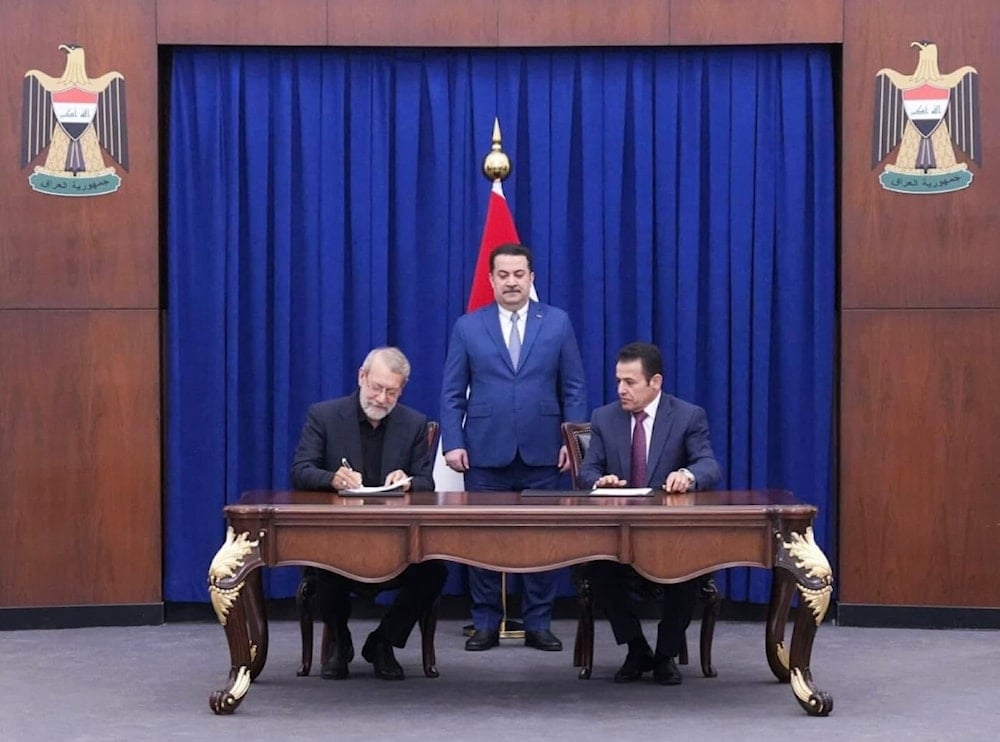 Iranian Supreme National Security Council Secretary-General Ali Larijani and Iraqi National Security Advisor Qassem al-Araji sign a security memorandum with the attendance of Iraqi PM Mohammad Shia al-Sudani, August 11, 2025 (X/ @qassimalaraji)