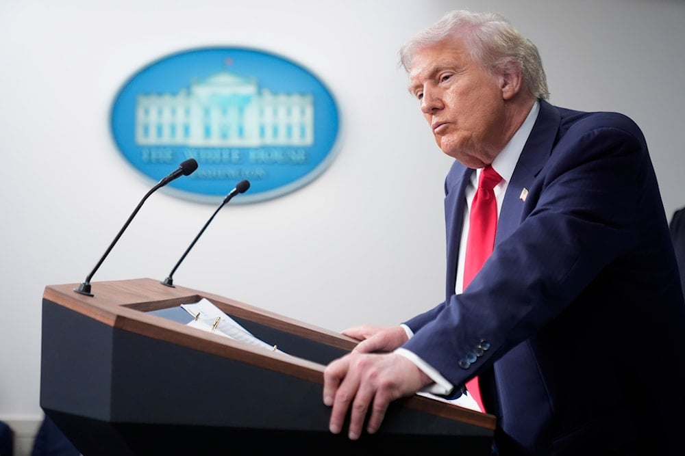 President Donald Trump listens to a question from a reporter in the James Brady Press Briefing Room at the White House, Monday, Aug. 11, 2025, in Washington (AP)
