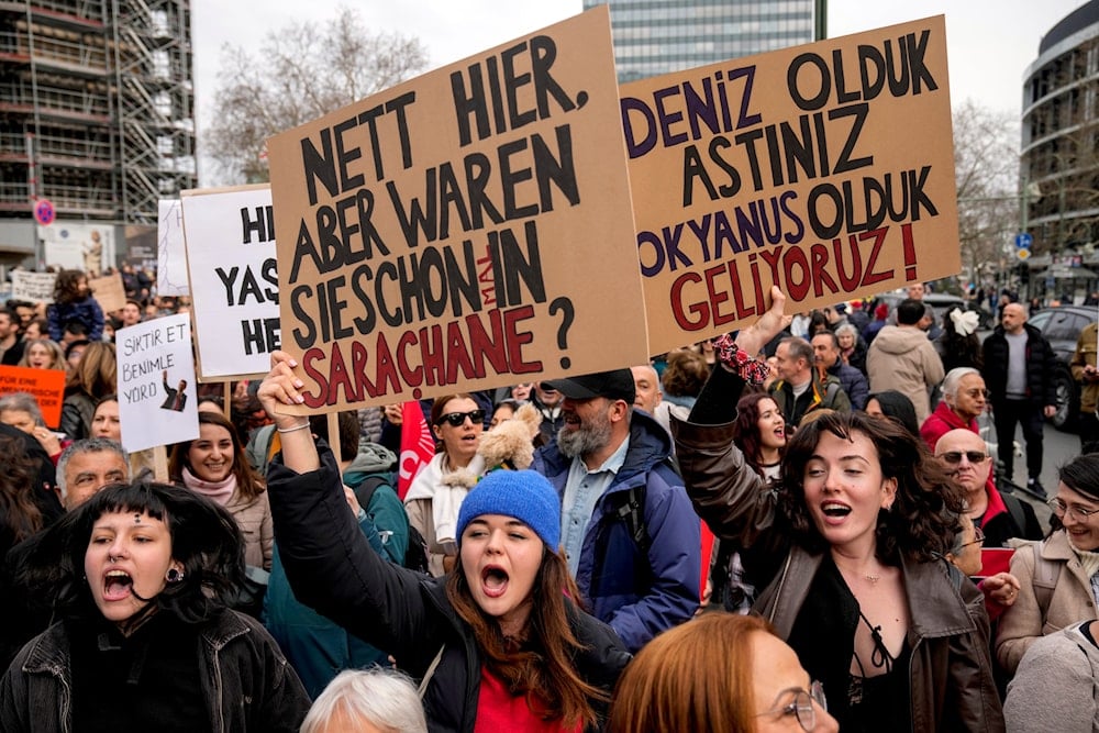 Protesters shout slogans during a protest against the arrest of Istanbul's Mayor Ekrem Imamoglu in Berlin, Germany on March 23, 2025. (AP Photo/Ebrahim Noroozi)