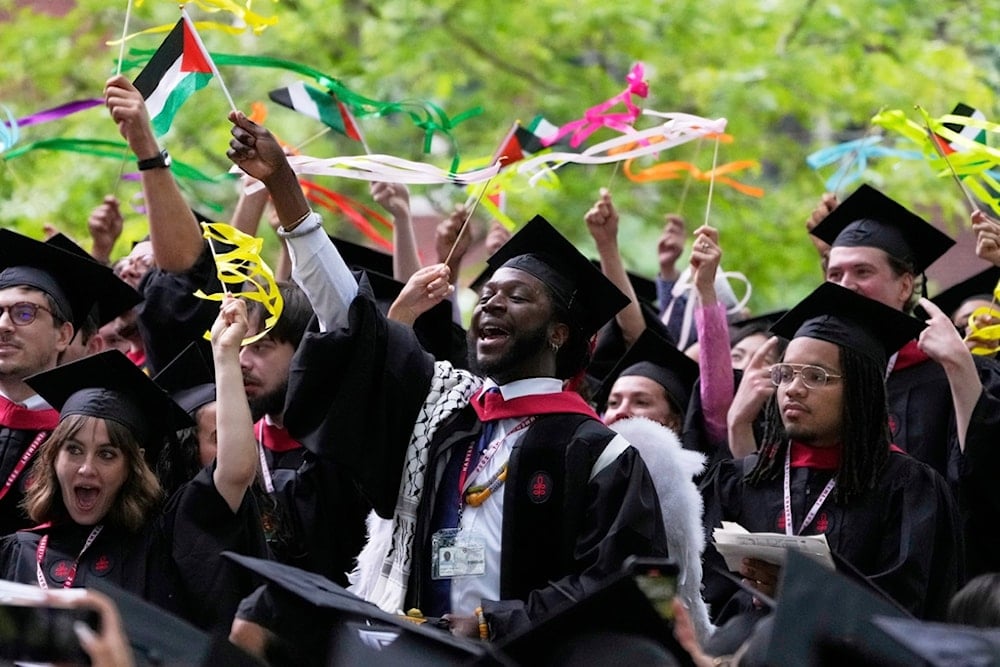 Students celebrate during commencement ceremonies at Harvard University, Thursday, May 29, 2025, in Cambridge, Massachusetts (AP)