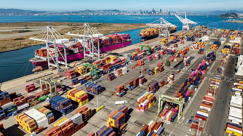 Cargo containers are seen at a shipping terminal at the Port of Oakland on Wednesday, Aug. 6, 2025, in Oakland, Calif. (AP Photo/Noah Berger)