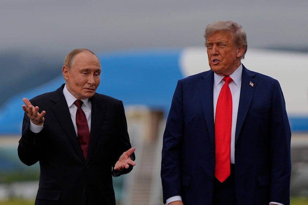 President Donald Trump talks with Russia's President Vladimir Putin Friday, August 15, 2025, at Joint Base Elmendorf-Richardson, Alaska (AP)