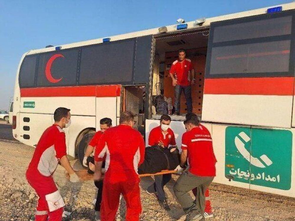Iranian Red Crescent teams evacuate an injured Arbaeen pilgrim after a bus accident near the Mehran border crossing. (Agencies)