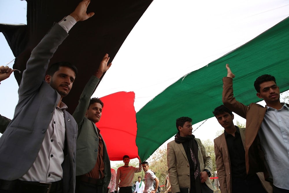 Students raise a Palestinian flag during a rally at the Sanaa University, Yemen, Wednesday, July 16, 2025 (AP)