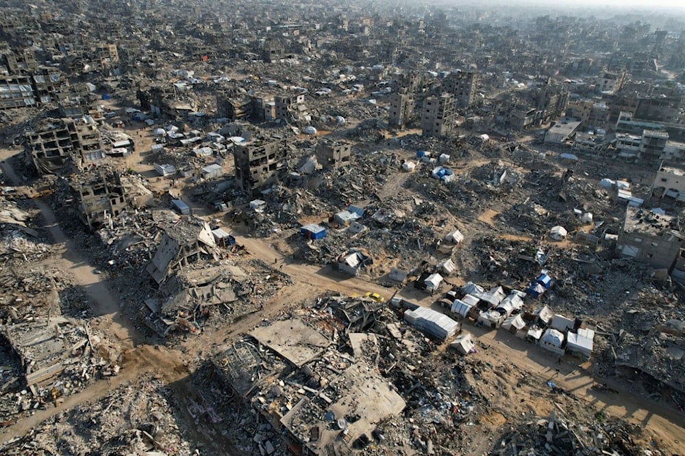 An aerial photograph taken by a drone shows tents amidst the destruction caused by the Israeli air and ground offensive in Beit Lahiya, northern Gaza Strip, on Monday, February 17, 2025 (AP)