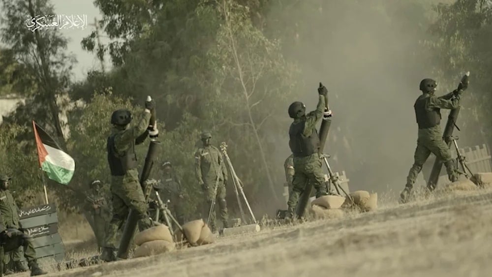 Palestinian resistance fighters launch mortar shells toward Israeli occupation positions in Gaza, in a scene from a video released by the resistance's military media.