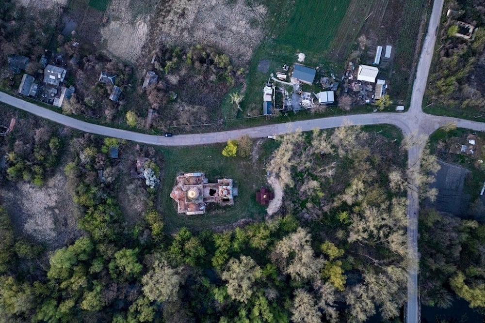 A church destroyed in fighting between Russian and Ukrainian forces is seen from above during the celebration of the Orthodox Easter in Lukashivka village, Ukraine, on Sunday, April 20, 2025 (AP)