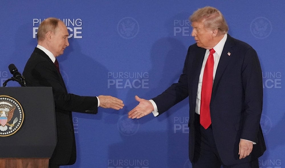 President Donald Trump, right, walks to shake the hand of Russia's President Vladimir Putin during a joint press conference at Joint Base Elmendorf-Richardson, Alaska, Friday, Aug. 15, 2025. (AP)
