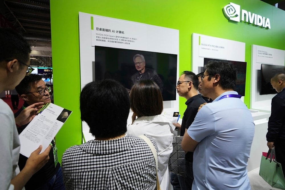 An exhibitor introduces the Nvidia DGX Spark to visitors at the Nvidia exhibition booth during the 3rd China International Supply Chain Expo at the China International Exhibition Center, in Beijing, Thursday, July 17, 2025 (AP)