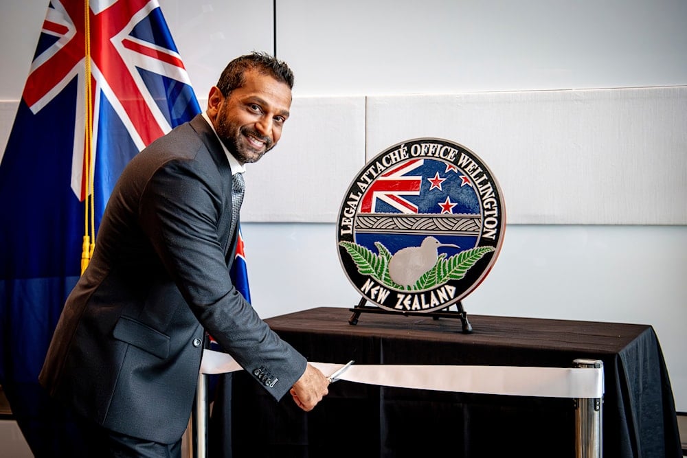 In this photo released by the US Embassy in Wellington, New Zealand, FBI Director Kash Patel cuts the ribbon at the official opening of the FBI office in Wellington, New Zealand, on July 31, 2025. (Ola Thorsen/US Embassy via AP)