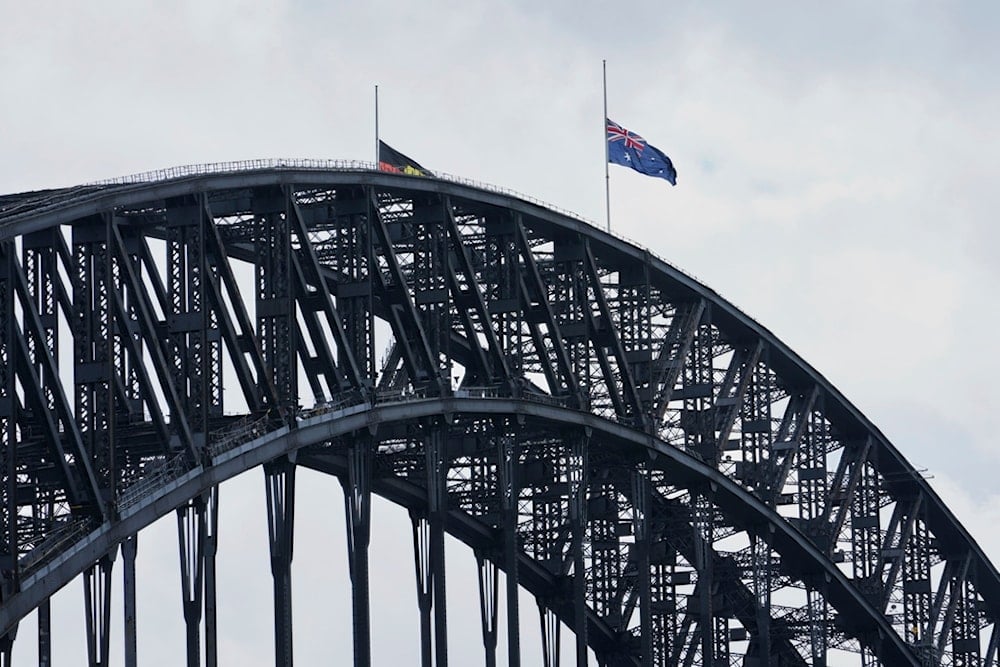 Flags fly at half mast atop of the Sydney Harbour Bridge following the death of Pope Francis, in Sydney, Australia, Tuesday, April 22, 2025. (AP Photo/Rick Rycroft)