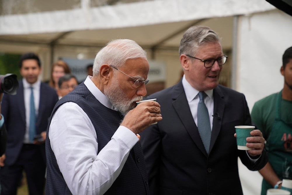 Britain's Prime Minister Keir Starmer and Prime Minister Narendra Modi of India, have a cup of tea during a business showcase event at Chequers near Aylesbury, England, Thursday, July 24, 2025 (AP)