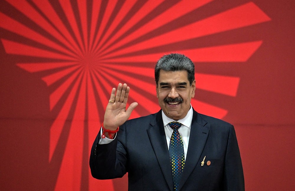 Venezuela's President Nicolas Maduro waves during the opening of the XXIV ALBA-TCP Summit in Caracas on Dec 14, 2024. (PHOTO / AFP)