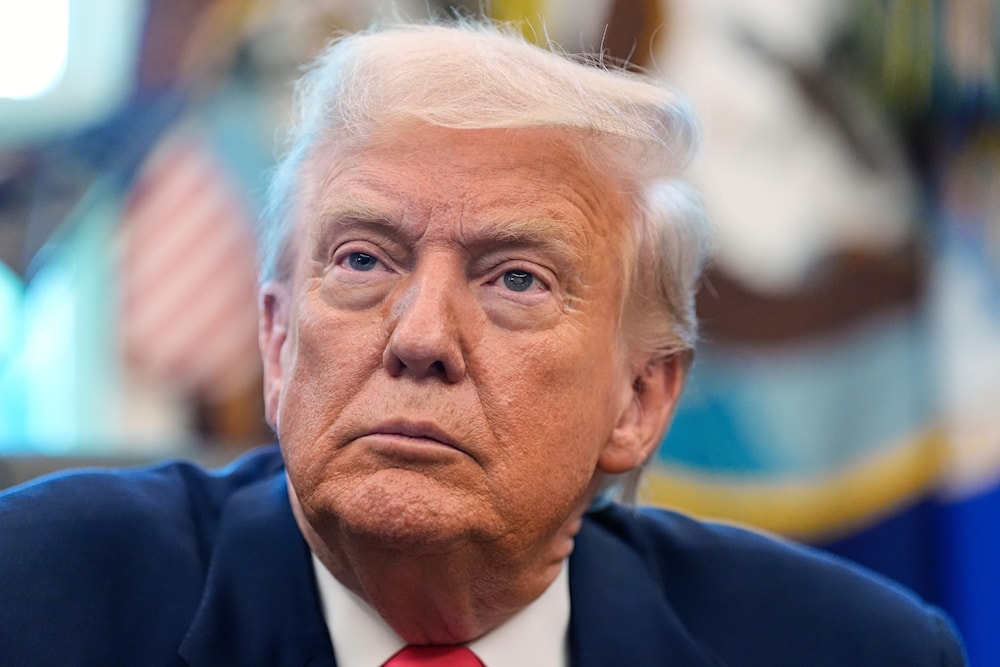 President Donald Trump listens during an event in the Oval Office to mark the 90th anniversary of the Social Security Act, on August 14, 2025, in Washington. (AP Photo/Alex Brandon)