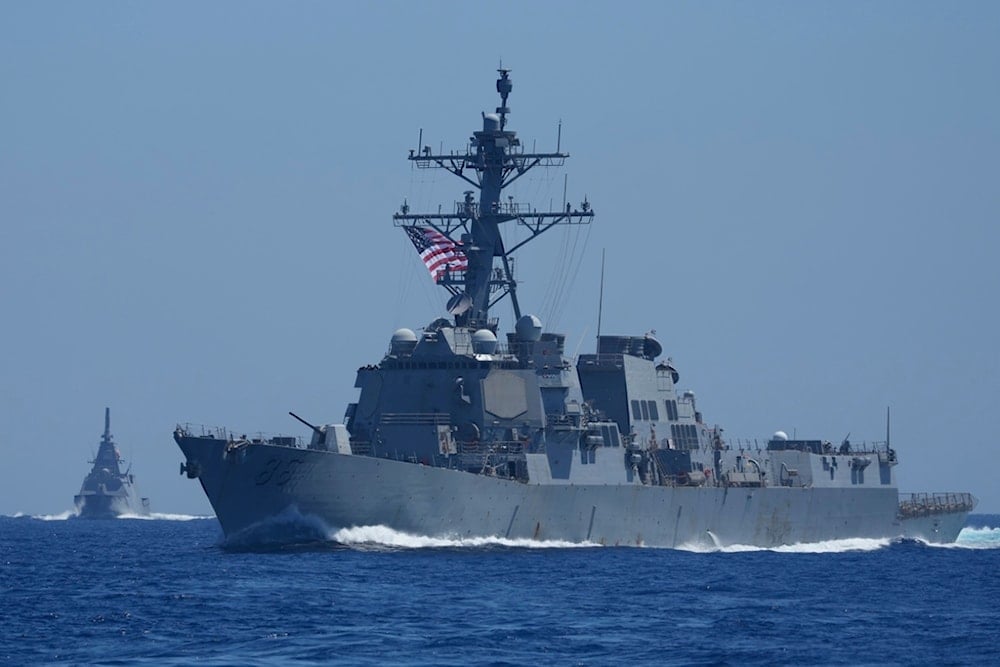 A US Navy USS Shoup (DDG86), right, and Japanese Maritime Self-Defence Force (JMSDF) frigate JS Noshiro off a disputed South China Sea shoal on Friday, March 28, 2025 (AP)