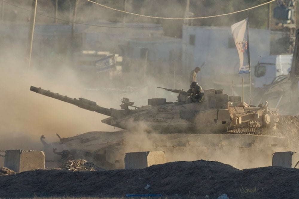 An Israeli tank moves near the border of the Gaza Strip in southern occupied Palestine, Wednesday, Aug. 6, 2025. (AP Photo/Ohad Zwigenberg)