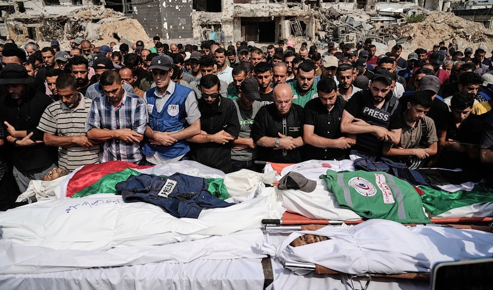 Palestinians pray over the bodies of journalists, including correspondents Anas al-Sharif and Mohamed Qreiqeh, who were killed in an Israeli airstrike, during their funeral outside Gaza City's Shifa hospital, Aug. 11, 2025. (AP)