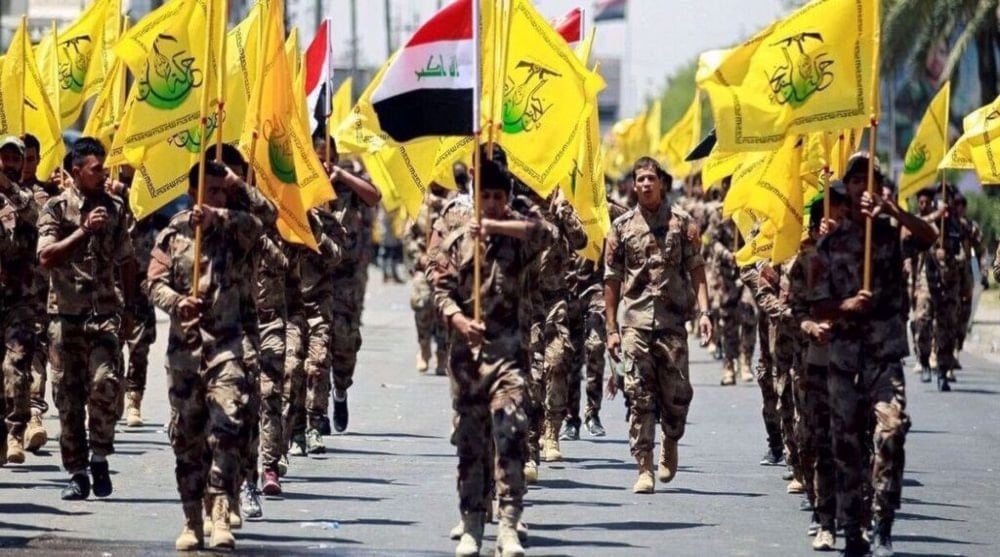 Members of the Iraqi Harakat Hezbollah al-Nujaba anti-terror resistance groups are seen during a military parade in Baghdad, Iraq. (Agencies)