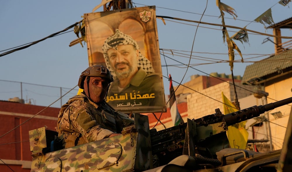 A Lebanese soldier sits on an armored personnel carrier at the entrance of Burj al-Barajneh Palestinian refugee camp where Palestinian factions handed over weapons to the Lebanese army, in Beirut, Aug. 21, 2025. (AP)